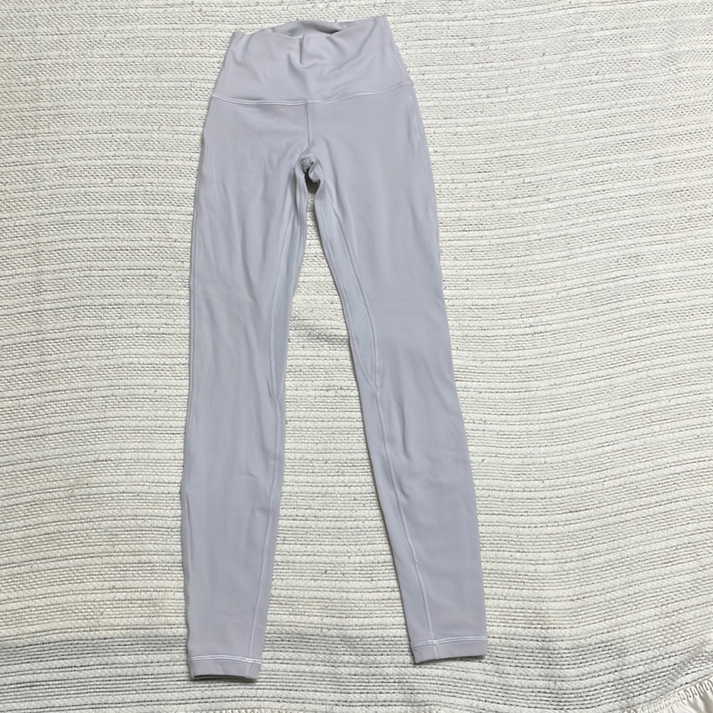 Ladies Lululemon athletic leggings small in a light gray/silver with a pocket